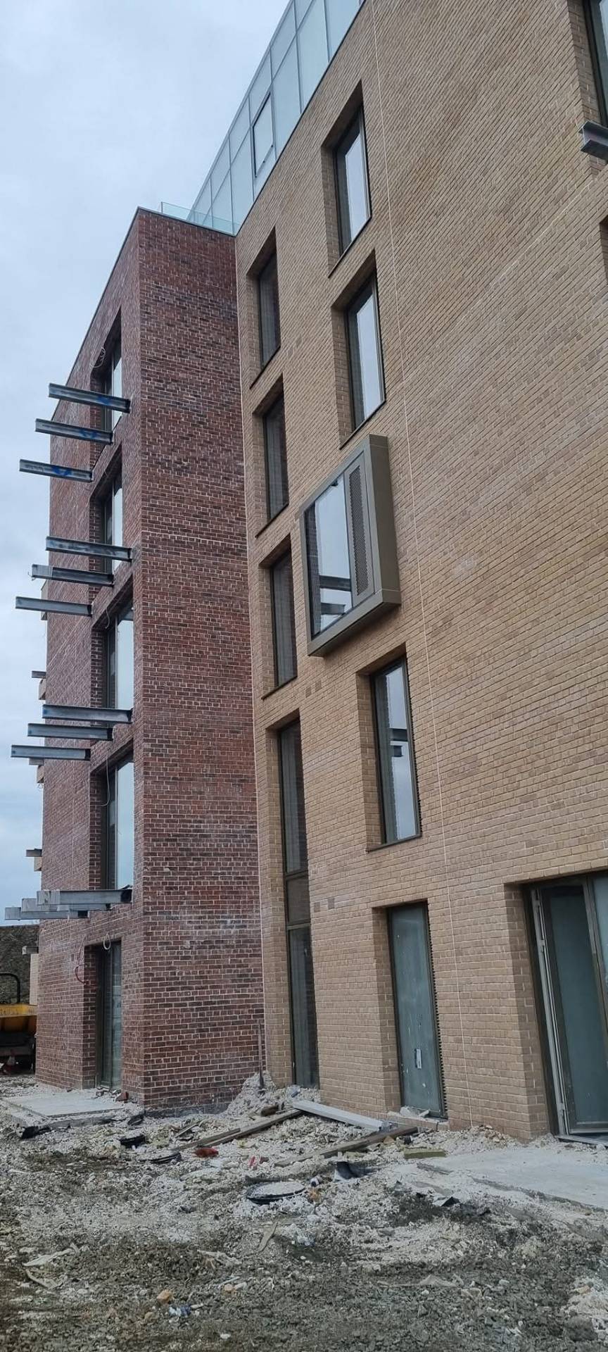 Two-tone brickwork on multi-storey apartment elevation